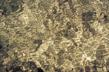 Abstract golden sea water reflections