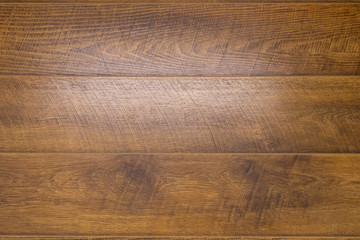 Parquet made of natural hardwood with a glare of sunlight.