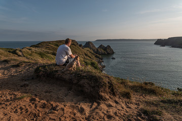 Walking the dog at Three Cliffs Bay Swansea Gower