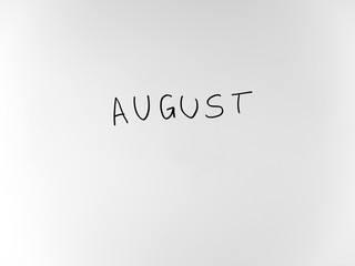 written in marker by hand text august