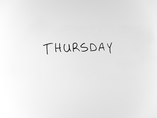 written in marker by hand text thursday