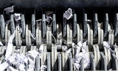closeup view of office paper shredder teeth 