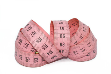 pink measuring tape, to control body measurements or use of seamstresses, isolated on white background