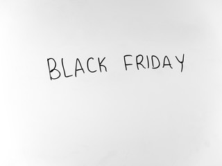 written in marker by hand text black friday
