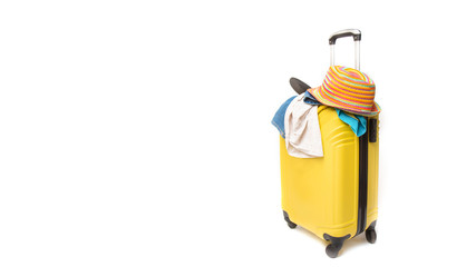 yellow suitcase with clothes of ttourist on a white background. concept quick fees late on the plane
