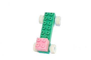 children's toy - building blocks in plastic color bricks, isolated on white background