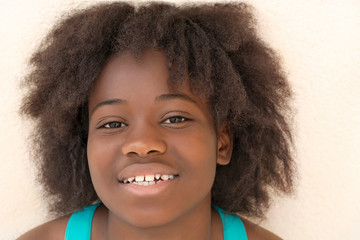 Portrait of a preteen girl smiling, thirteen years old