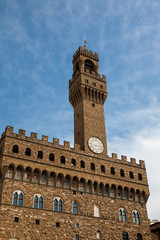 Fototapeta na wymiar Clock tower of the Palazzo Vecchio built at the Piazza della Signoria in the 12th century in Florence