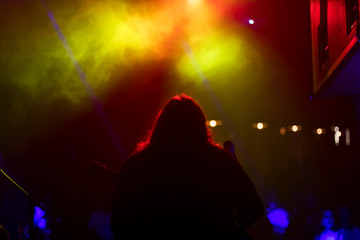 silhouette of a man on stage