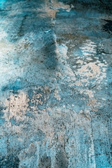 Texture of decorative plaster. Stylized banner with space for text. Grungy concrete wall with colorful lighting. Old gray surface for background in soft focus with blurred edges and film grain.