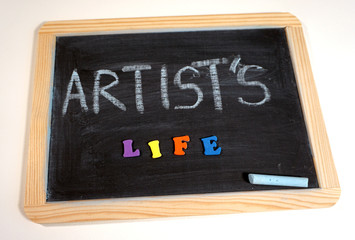 Fototapeta na wymiar Artist's life message on chalkboard
