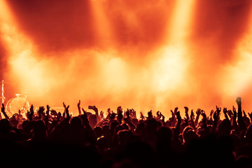 Fototapeta na wymiar silhouettes of crowd at rock concert
