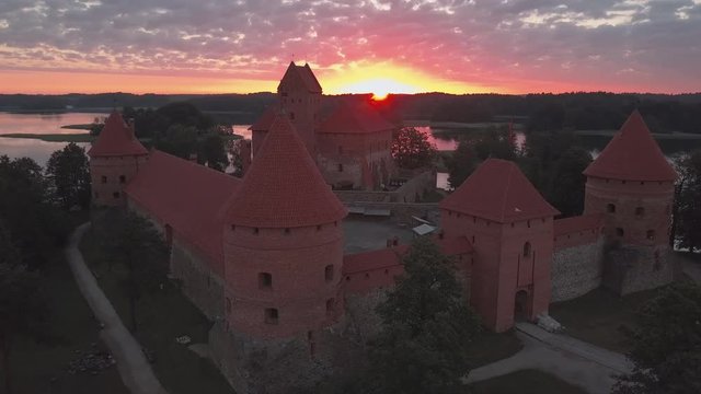Castle close-up at sunrise. Water reflections