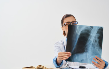 doctor with stethoscope and chart