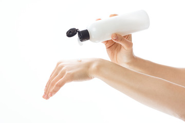 hand with bottle of water isolated on white