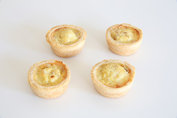 Tasty Mini Quiches Isolated in a White Background.