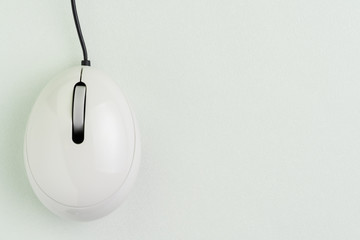 White clean wireless computer mouse on gray background with copy space using as click through rate, online marketing, usage history or online e-commerce concept