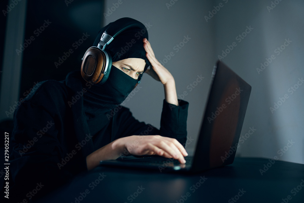 Poster hacker stealing data from laptop