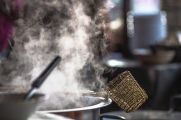 Blurred wallpaper of smoke from boiling water,seasoning(noodles) with meat,cartilage It takes quite a long time to boil,has a fragrant flavor and is more delicious,seen in the street food district