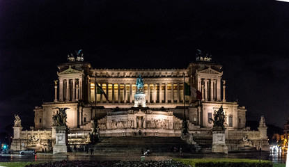 Naklejka premium The Altare della Patria illuminated at night is a monument built in honor of Victor Emmanuel II, the first king of a unified Italy, located in Rome, Italy.
