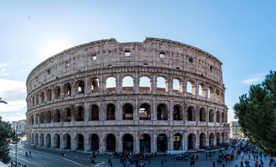 Fototapeta na wymiar A panoramic of Colosseum or Coliseum is an oval amphitheater in the center of the city of Rome, Italy. Built of travertine, tuff, and brick-faced concrete, it is the largest amphitheater ever built.