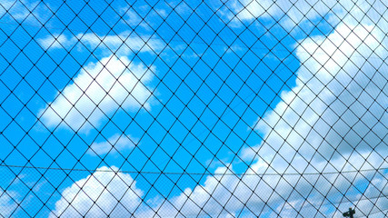 Nets to block the football field to prevent the ball from missing the sky background.