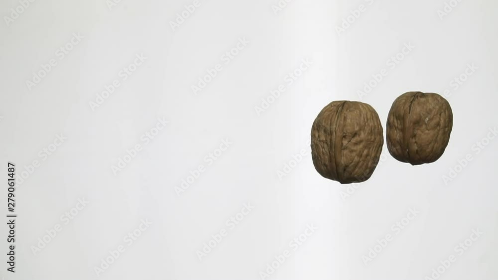 Poster walnuts rolling on a table in slow motion 100 fps