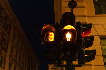 traffic light on street in evening in rome, italy