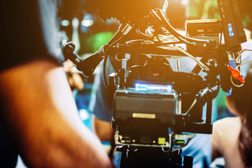 Behind the scene. cameraman shooting film scene with camera