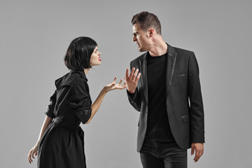 man and woman fighting over white background