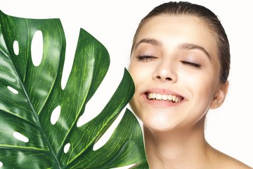 young woman with perfect skin looking at camera