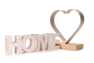 Word HOME and heart-shaped decor on white background