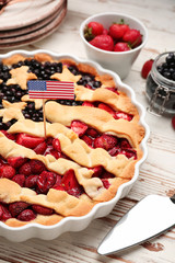 Tasty American flag pie on wooden background, closeup