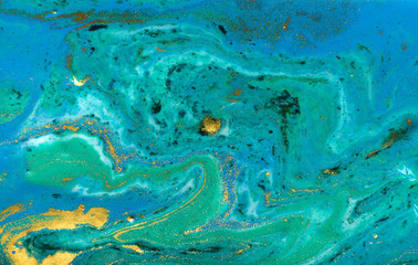 Blue, green and gold marbling pattern. Golden powder marble liquid texture.