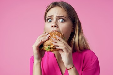 portrait of young woman eating cake