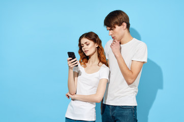 young couple with mobile phone