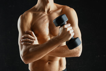 Fototapeta na wymiar muscular male bodybuilder posing on black background