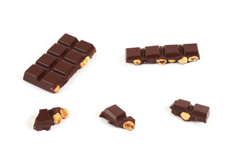 Chocolate pieces with nuts isolated on white background