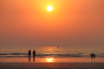 Fototapeta premium silhouette of fisherman at sunset