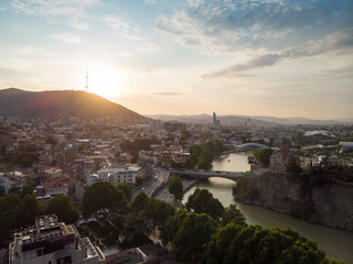 Fototapeta na wymiar Aerial Cityscape of Tbilisi, Georgia, sunset and cityscape of Tbilisi, Georgia, view on the mountains on backround.