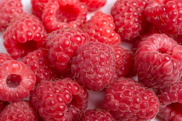 Fresh red raspberries on white background. Close Up.