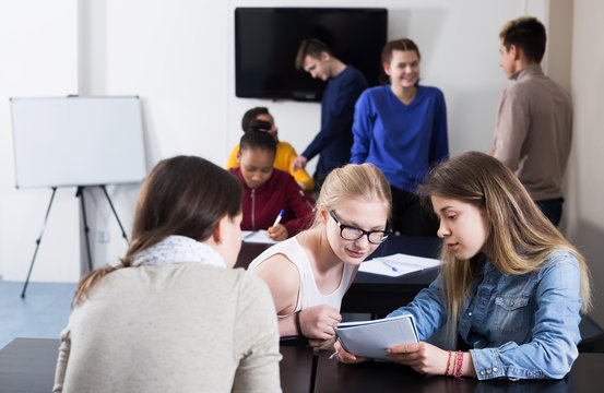 Girl consulting fellow student