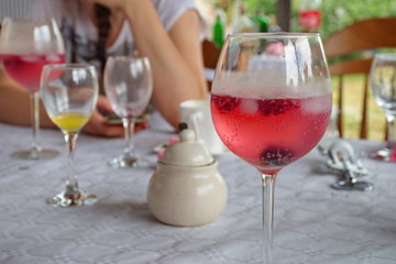 Red wine and juice on the table in the backyard