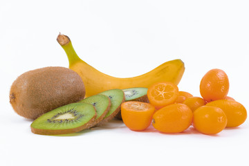 Colorful photo of a fruit snack - Banana, sliced ripe oranges and sliced green kiwis on a white background - Sweet oranges - Green kiwis