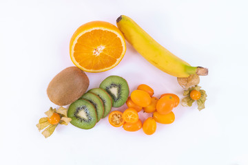 Top view of a sweet and tasty tropical snack - Ripe oranges, green kiwi and banana