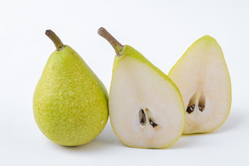 Fototapeta na wymiar A pear in two halves accompanied by a whole pear isolated on a white background - Green and sweet pears