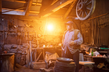 portrait of confident senior blacksmith