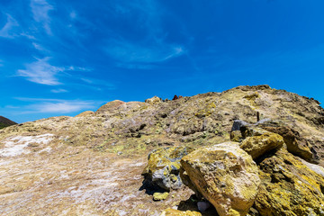 yellow vulcanic rock with deep bleu sky