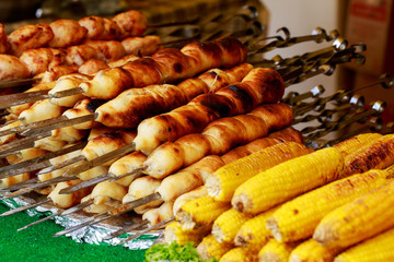 Corn and sausages in dough