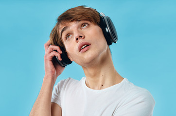 young man listening to music on headphones